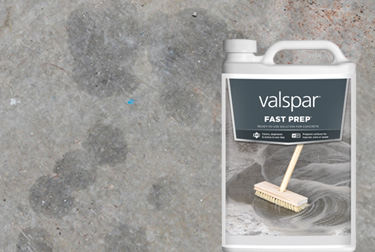 Container of Valspar Fast Prep in foreground against a concrete background.